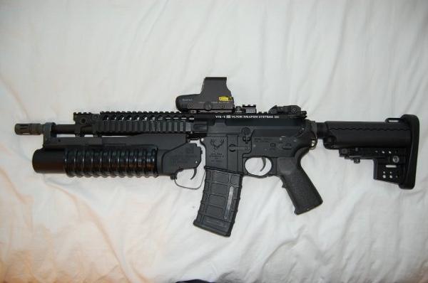 VLTOR M4K w/ custom 12.5" Barrel, Magpul MIAD. PMAG, VLTOR Clubfoot Stock, EOTech Holosight,M203 Short.